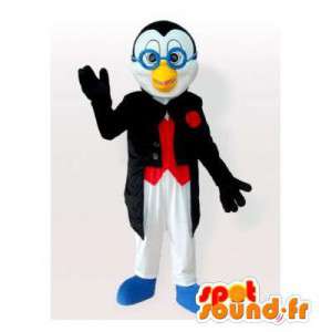 Pingvinmaskot i smoking med blåa glasögon