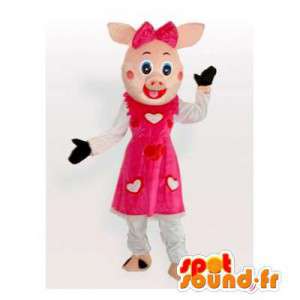 Rosa grismaskot med en klänning med hjärtan - Spotsound maskot