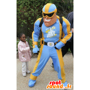 Mascotte de super-héros en tenue bleue et jaune dans Mascotte de