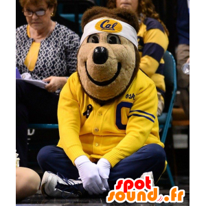 Mascote do urso marrom, vestido em esportes amarelo e azul - MASFR20443 - mascote do urso