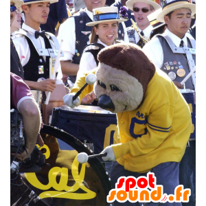 Brun bjørnemaskot, i gul og blå sportstøj - Spotsound maskot