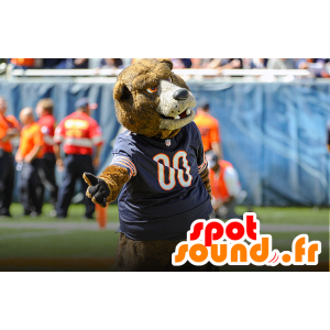 A brown bear mascot with a blue jersey - MASFR20485 - Bear mascot