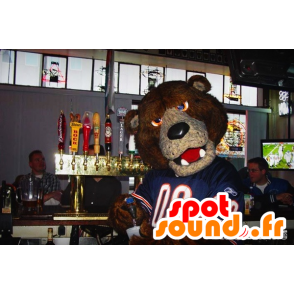 A brown bear mascot with a blue jersey - MASFR20485 - Bear mascot