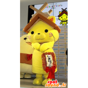 Gele kat mascotte met een huis dak boven je hoofd - MASFR20595 - mascottes Huis