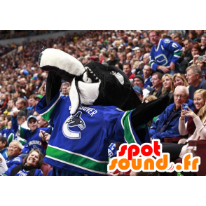 Svart och vit späckhuggarmaskot, i hockeyklädsel - Spotsound
