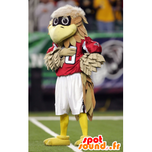 Brun og beige fuglemaskot i rødt outfit - Spotsound maskot