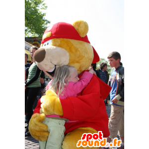 Atacado amarelo da mascote e urso vermelho com um chapéu - MASFR20727 - mascote do urso