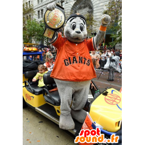 Mascotte graue Seelöwe mit einem orangefarbenen Hemd - MASFR20862 - Maskottchen-Siegel