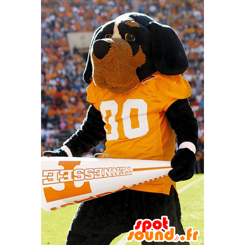 Black and brown dog mascot with a yellow t-shirt - MASFR20882 - Dog mascots Black and brown dog mascot with a yellow t-shirt - MASFR20882 - Dog mascots