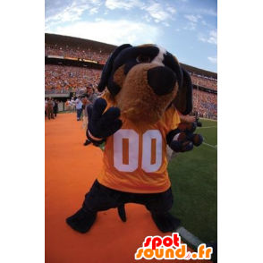 Mascote preto e marrom cão com uma camisa amarela - MASFR20882 - Mascotes cão