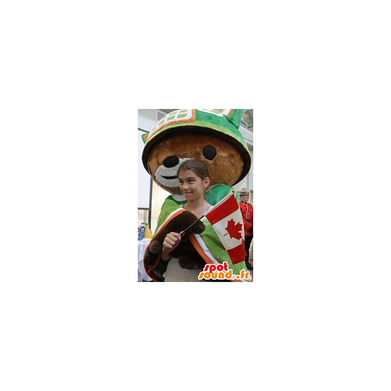 A brown bear mascot with a cape and a green helmet - MASFR20884 - Bear mascot