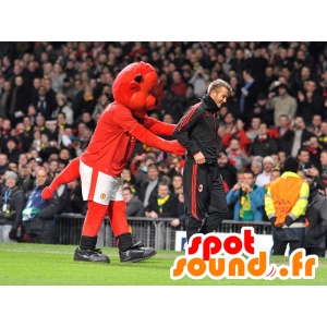 Röd björnmaskot i sportkläder - Spotsound maskot