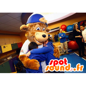 A brown bear mascot with a cap - MASFR21035 - Bear mascot