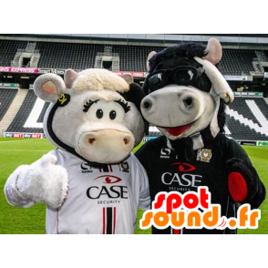 2 ko maskotter, en hvid og en sort - Spotsound maskot kostume