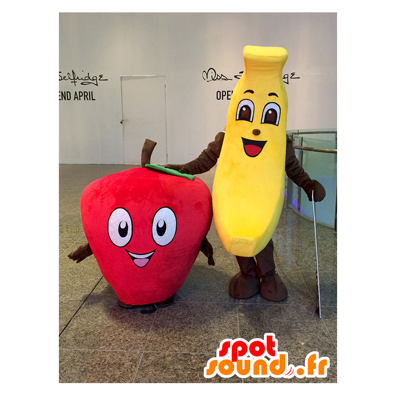 2 maskotar: en gul banan och en röd jordgubbe - Spotsound maskot