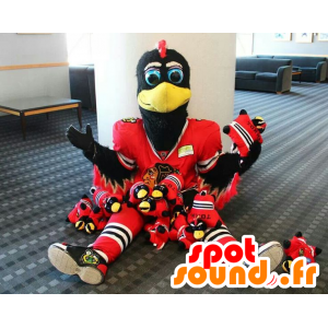 Mascot black and white bird with a red sports outfit - MASFR21450 - Mascot of birds
