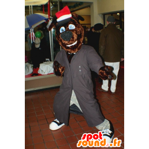 Mascote do cão marrom com um casaco cinza longo e chapéu - MASFR21499 - Mascotes cão
