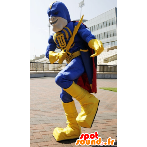 Super-herói mascote segurando amarela e azul, com uma capa - MASFR21508 - super-herói mascote