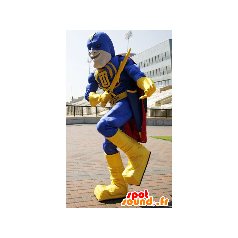 Super-herói mascote segurando amarela e azul, com uma capa - MASFR21508 - super-herói mascote