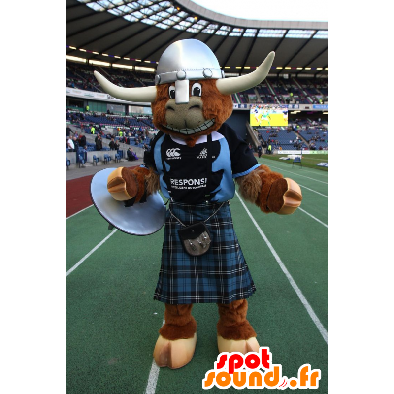Hnědý krávou maskot, býk, s kilt a helma - MASFR21587 - kráva Maskoti Hnědý krávou maskot, býk, s kilt a helma - MASFR21587 - kráva Maskoti