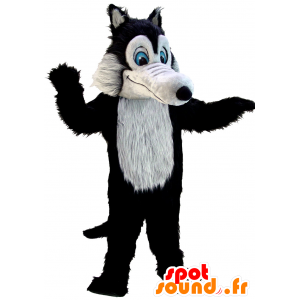 Mascote do lobo preto e cinza, enquanto peludo, de olhos azuis - MASFR21970 - lobo Mascotes