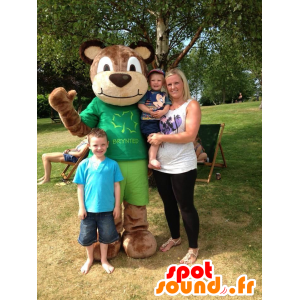 Brown teddy mascot holding green - MASFR22001 - Bear mascot
