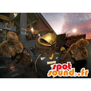 Of brown eagle mascot in black sportswear - MASFR22062 - Mascot of birds