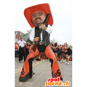 Mascotte de cow-boy en habit traditionnel orange et noir - MASFR22102 - Mascottes Humaines