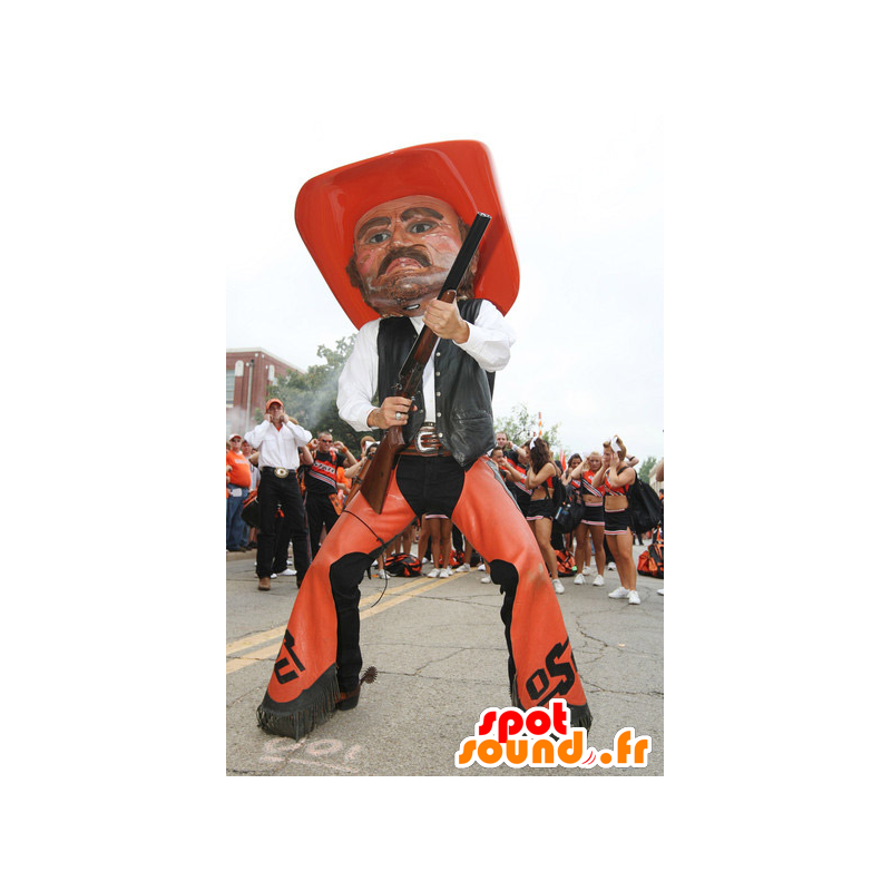 Cowboy maskotti oranssi ja musta perinteisessä asussa - MASFR22102 - Mascottes Humaines