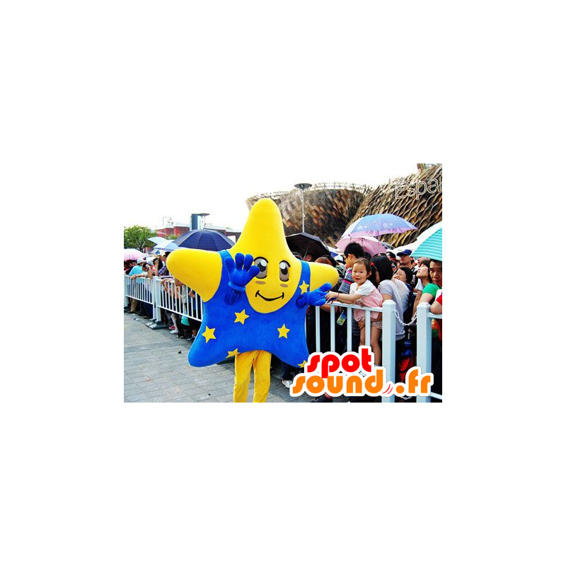 Mascotte estrella amarilla gigante con un traje azul - MASFR22139 - Mascotas sin clasificar