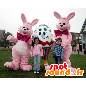 3 maskotar påsk, 2 rosa kaniner och ett jätteägg - Spotsound