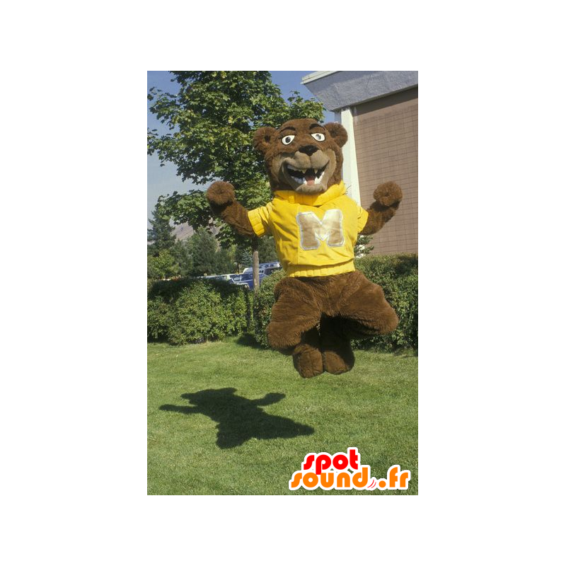 A brown bear mascot with a yellow sweat shirt - MASFR22216 - Bear mascot