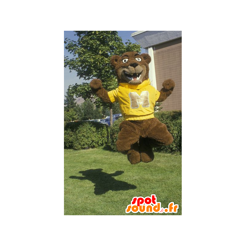 Ein brauner Bär Maskottchen mit einem gelben Sweatshirt - MASFR22216 - Bär Maskottchen