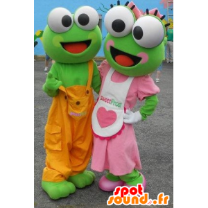 2 maskotar av gröna grodor i färgglad outfit - Spotsound maskot