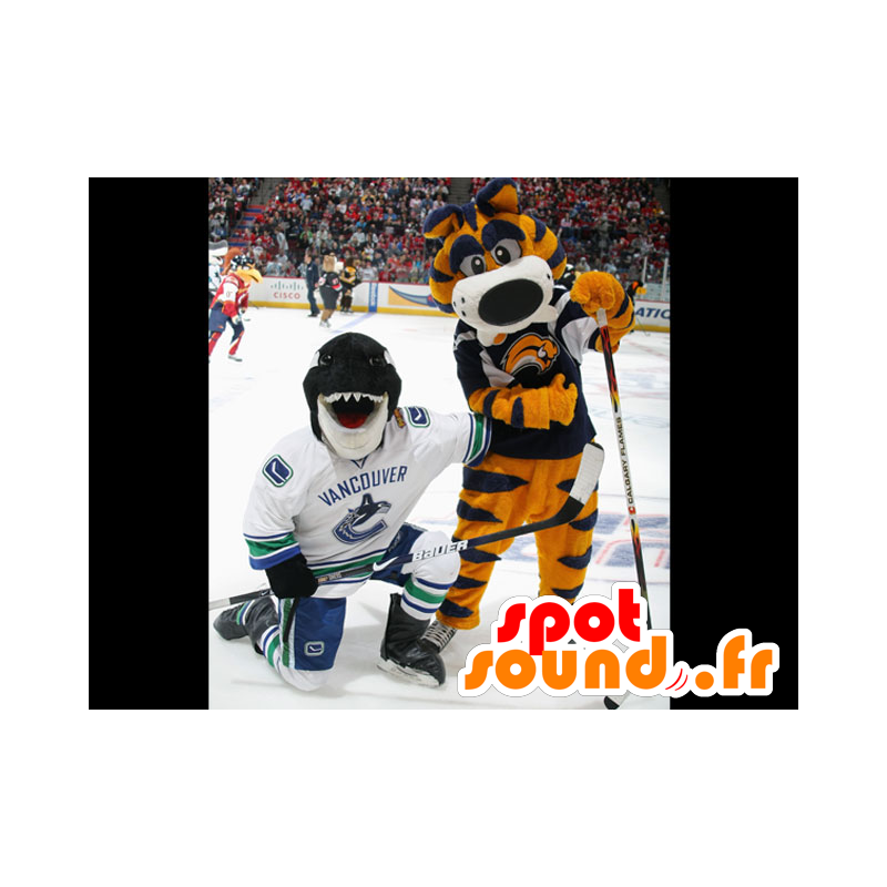 2 mascots, yellow and blue tiger, and an orca, a black shark - MASFR22365 - Tiger mascots 2 mascots, yellow and blue tiger, and an orca, a black shark - MASFR22365 - Tiger mascots