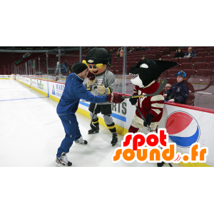 Blond boy mascot and black orc hockey outfit - MASFR22379 - Mascots child