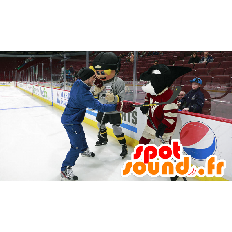 Mascot blond pojke och svart späckhuggare i hockeyklädsel - Mascot blond pojke och svart späckhuggare i hockeyklädsel -