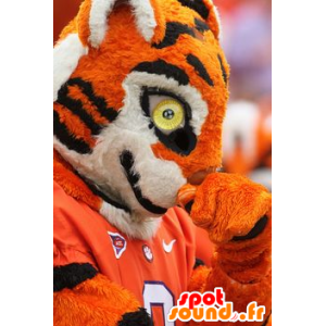 Mascotte de tigre orange, noir et blanc, en tenue de sport - MASFR22387 - Mascottes Tigre
