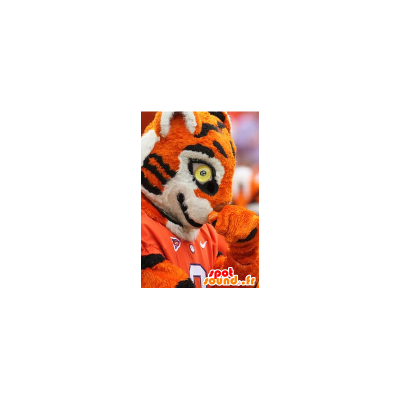 Mascotte de tigre orange, noir et blanc, en tenue de sport - MASFR22387 - Mascottes Tigre Mascotte de tigre orange, noir et blanc, en tenue de sport - MASFR22387 - Mascottes Tigre