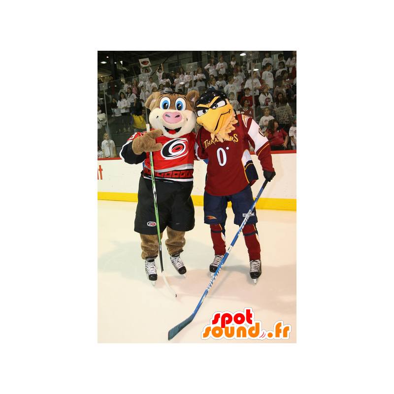 2 mascots, a brown pig, and a beige eagle - MASFR22397 - Mascots pig 2 mascots, a brown pig, and a beige eagle - MASFR22397 - Mascots pig