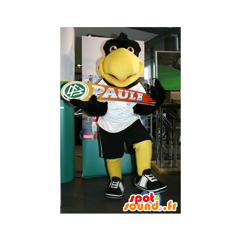 Mascotte de gros oiseau noir et jaune, en tenue de sport - MASFR22459 - Mascotte d'oiseaux