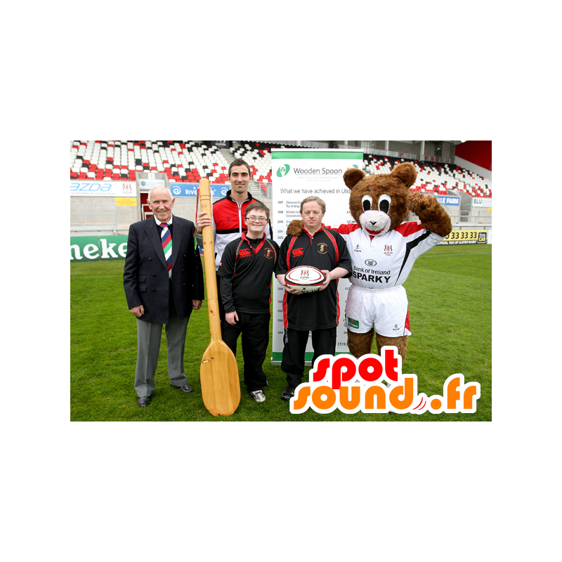 Brun og hvid bamse-maskot med sportsudstyr - Spotsound maskot