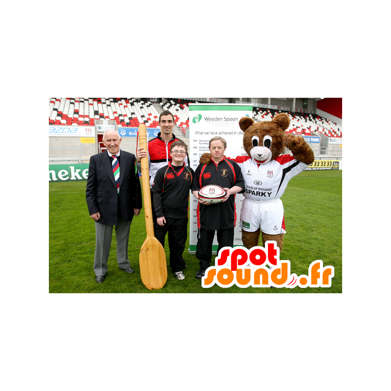 La mascota de color marrón y blanco de peluche con un equipo de los deportes - MASFR22465 - Oso mascota