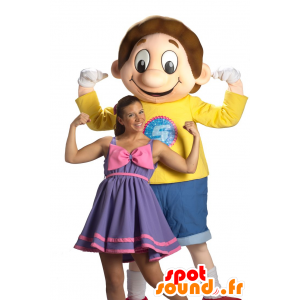 Αγόρι μασκότ, ντυμένοι με μπλε και κίτρινο χαμογελαστό μαθητής - MASFR22499 - μασκότ παιδιών