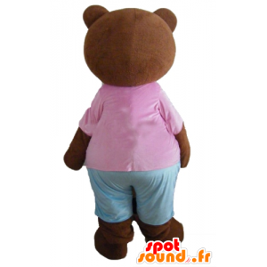 Liten brun björnmaskot, brun, med en rosa och blå outfit -