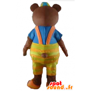Brun bjørnemaskot med gul overall og en t-shirt - Spotsound