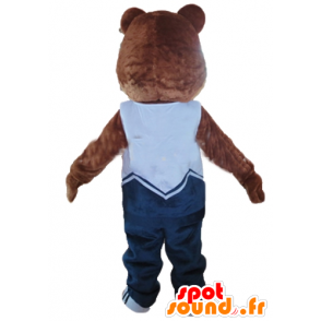 Brun och beige nallebjörnmaskot, i blå outfit - Spotsound maskot
