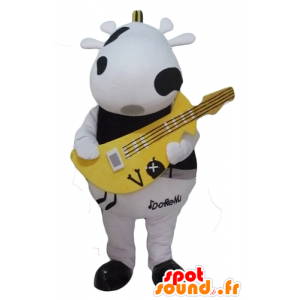 Svart och vit ko maskot, med en gul gitarr - Spotsound maskot
