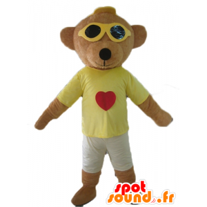 Mascotte de nounours marron, en tenue colorée, avec des lunettes - MASFR22812 - Mascotte d'ours