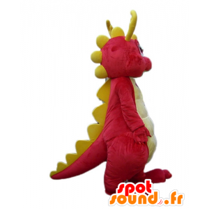 Rosafarbene und gelbe Dinosaurier-Maskottchen, lächelnd und bunt - MASFR22888 - Maskottchen-Dinosaurier